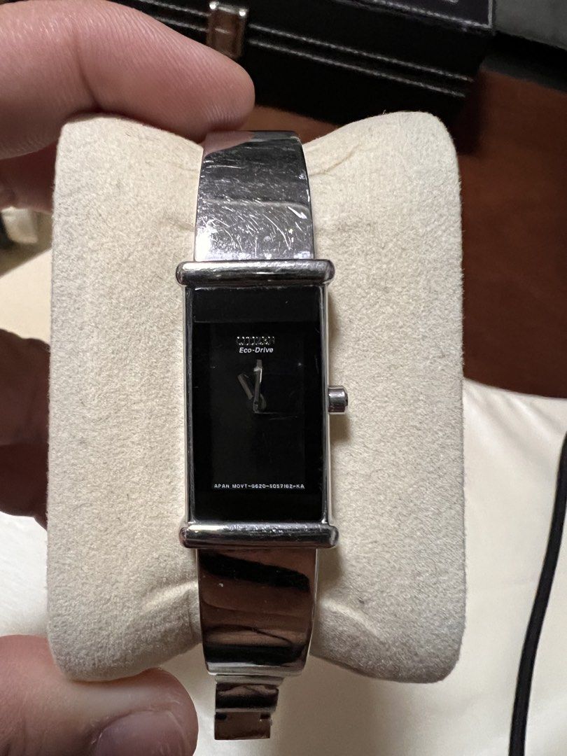 Citizen Eco-Drive Rectangular Silver Watch with Black Dial (Category: Luxury Watches) located in Manila. Submitted by kai.168 (Listing ID 1467119289, Image 1). Description: - Brand/Model: Citizen Eco-Drive Watch - Dial & Case: Clean black dial with minimalist hands in a rectangular silver case - Movement: Eco-Drive (powered by light, no battery changes needed) - Strap: Stainless steel bracelet with secure clasp closure - Condition: Minor surface 