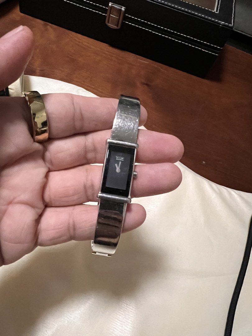 Citizen Eco-Drive Rectangular Silver Watch with Black Dial (Category: Luxury Watches) located in Manila. Submitted by kai.168 (Listing ID 1467119289, Image 2). Description: - Brand/Model: Citizen Eco-Drive Watch - Dial & Case: Clean black dial with minimalist hands in a rectangular silver case - Movement: Eco-Drive (powered by light, no battery changes needed) - Strap: Stainless steel bracelet with secure clasp closure - Condition: Minor surface 