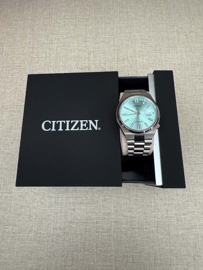 Citizen Tsuyosa Automatic Light Blue Dial Watch (Category: Men's Watches) located in Quezon City. Submitted by davidsgoodbuys (Listing ID 1467085672, Image 3). Description: - Model: Citizen Tsuyosa Automatic - Dial: Striking light blue with a clean layout - Features: Date window with magnifying lens and smooth automatic movement - Bracelet: Integrated stainless steel - Inclusions: Original black Citizen presentation box.