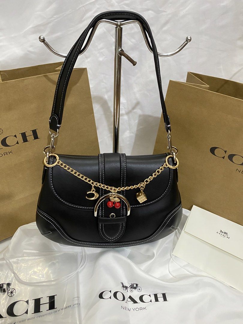Coach Black Leather Shoulder Bag with Charms (Category: Shoulder Bags) located in Manila. Submitted by grandowl_5653cd (Listing ID 1467153028, Image 1). Description: With Dust Bag Paper Bag .