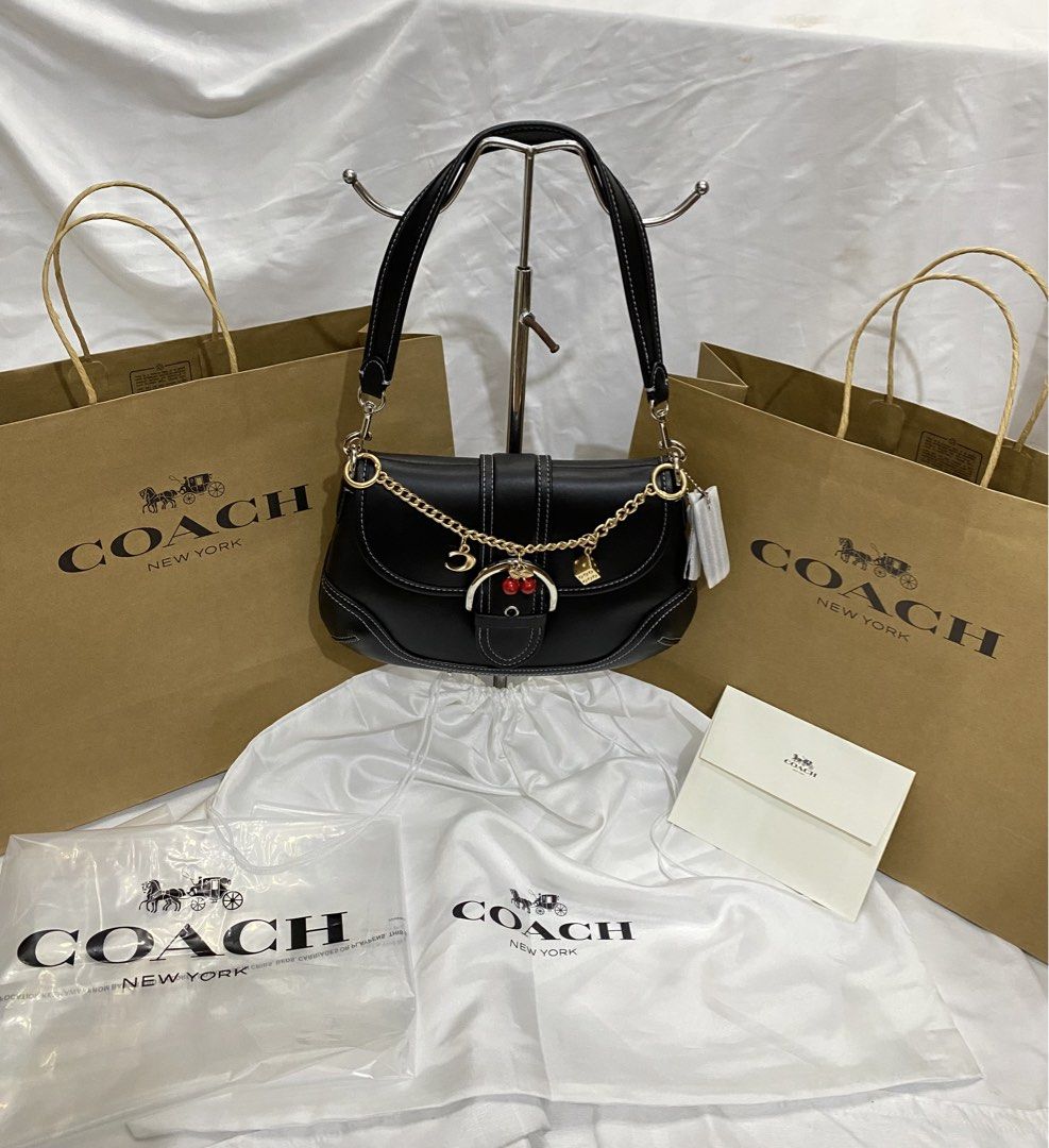 Coach Black Leather Shoulder Bag with Charms (Category: Shoulder Bags) located in Manila. Submitted by grandowl_5653cd (Listing ID 1467153028, Image 2). Description: With Dust Bag Paper Bag .