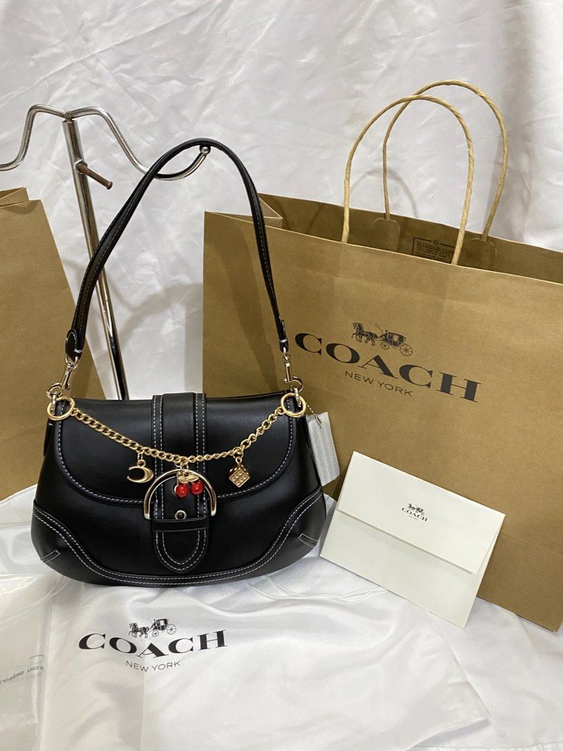 Coach Black Leather Shoulder Bag with Charms (Category: Shoulder Bags) located in Manila. Submitted by grandowl_5653cd (Listing ID 1467153028, Image 3). Description: With Dust Bag Paper Bag .