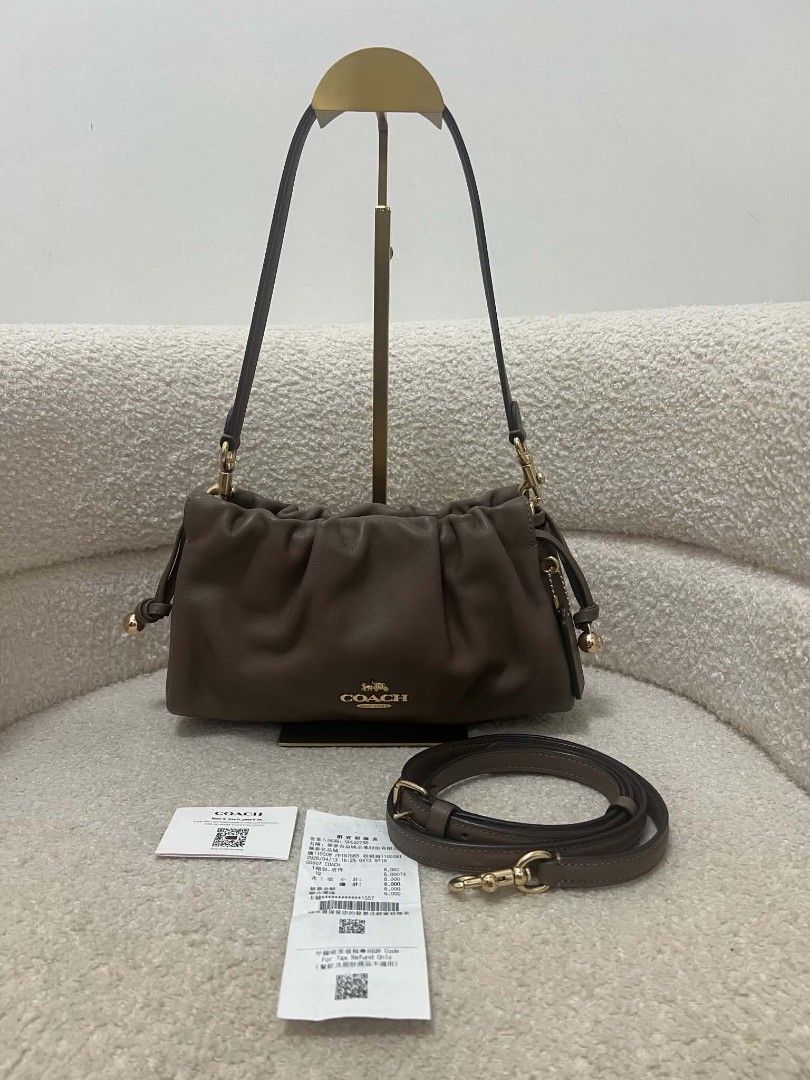 Coach Faye Shoulder Bag with Sling (Category: Shoulder Bags) located in Paoay. Submitted by rvf1230 (Listing ID 1467036081, Image 1). Description: Coach shoulder bag in rich brown leather. Gathered ruching detail along the top. Gold-tone hardware and Coach logo on the front. Includes main shoulder strap plus an extra adjustable crossbody strap. Inside features fabric lining, zippered pocket, and magnetic snap closure. Original store tags and rece