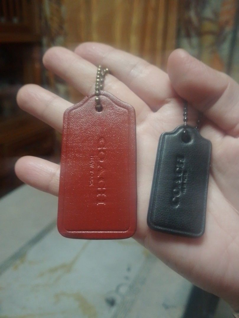 Coach Leather Hangtags Set Bag Charms (Category: Charms) located in Manila. Submitted by annemil_1984 (Listing ID 1466707065, Image 2). Description: - 100% Authentic Coach leather hangtags with ball chain straps - Includes dark grey embossed logo tag - Features dual-sided beige (with metal horse and carriage hardware) and vibrant blue tag - Dark gunmetal hardware throughout - Excellent, clean condition with no scuffs or cracks - Versatile accesso