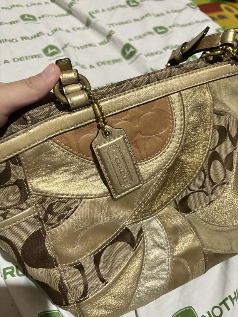 Coach Signature Patchwork Gold Tote Handbag (Category: Luxury Bags & Wallets) located in Manila. Submitted by dumayasque57133 (Listing ID 1467106940, Image 1). Description: - Authentic Coach signature patchwork tote bag - Metallic gold and brown tones with mixed jacquard fabric and metallic leather panels - Vibrant purple satin interior lining with a secure zip pocket - Double shoulder straps with adjustable buckle details - Includes original Coa