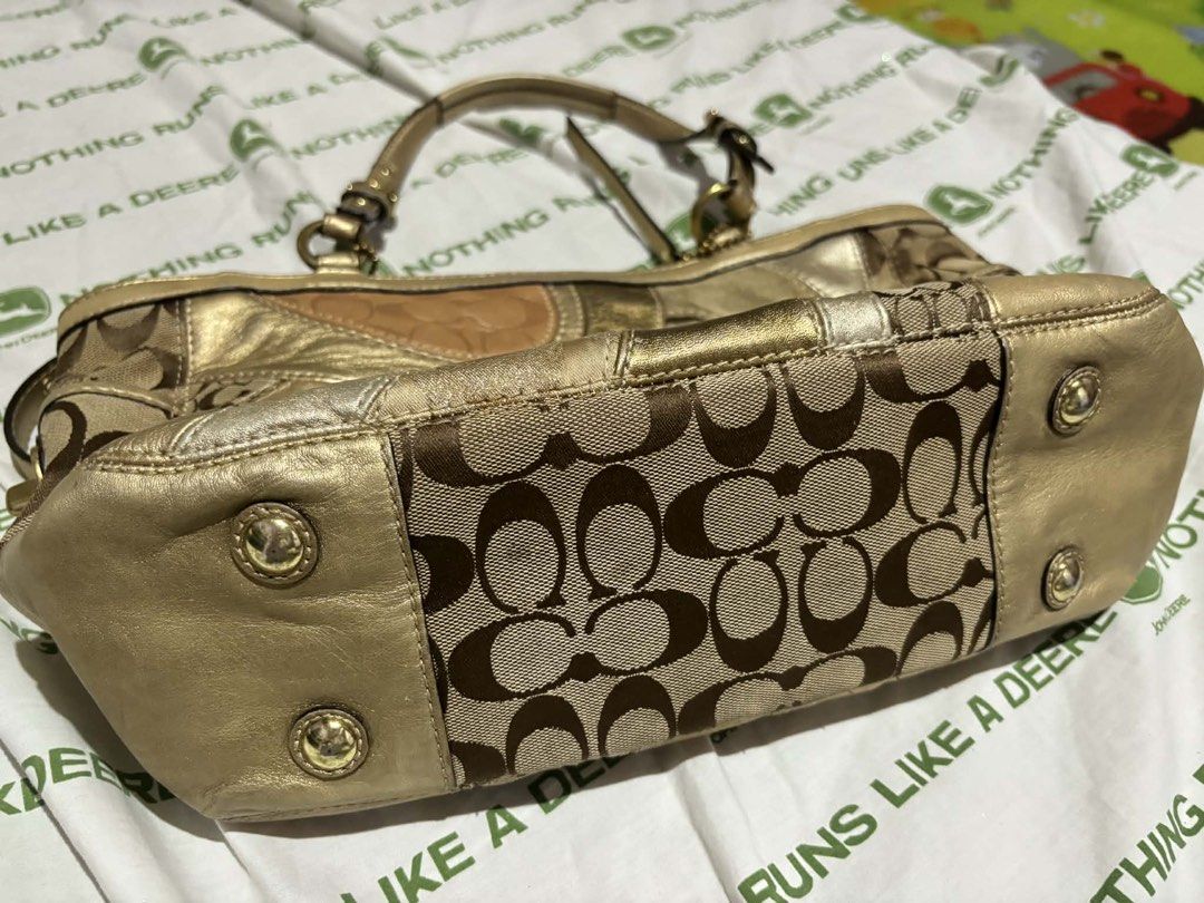 Coach Signature Patchwork Gold Tote Handbag (Category: Luxury Bags & Wallets) located in Manila. Submitted by dumayasque57133 (Listing ID 1467106940, Image 3). Description: - Authentic Coach signature patchwork tote bag - Metallic gold and brown tones with mixed jacquard fabric and metallic leather panels - Vibrant purple satin interior lining with a secure zip pocket - Double shoulder straps with adjustable buckle details - Includes original Coa