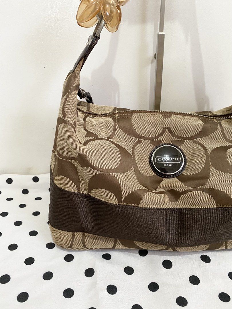 Coach Signature Stripe Hobo Bag (Category: Luxury Bags & Wallets) located in Angat. Submitted by raejinx (Listing ID 1466972479, Image 2). Description: .
