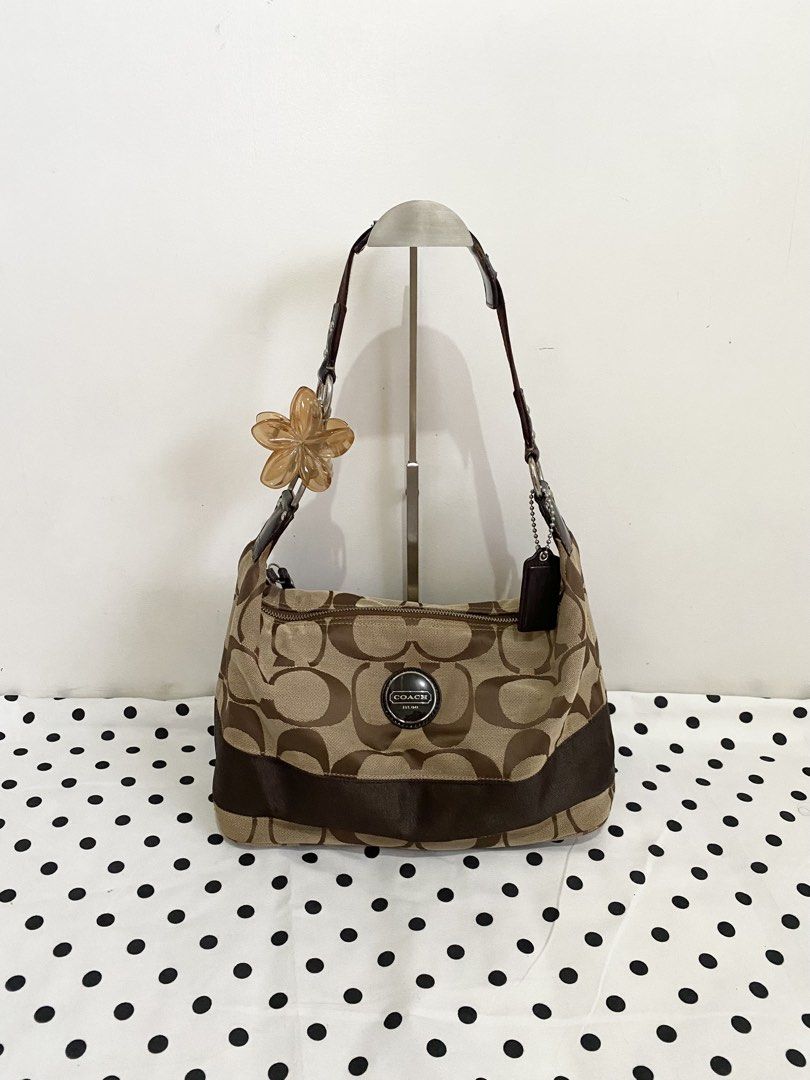 Coach Signature Stripe Hobo Bag (Category: Luxury Bags & Wallets) located in Angat. Submitted by raejinx (Listing ID 1466972479, Image 1). Description: .