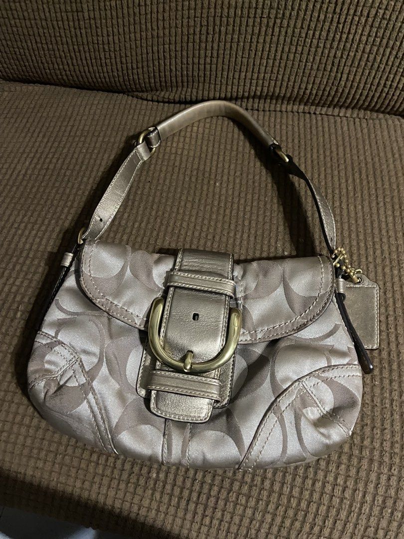 Coach Soho RARE Mini Sateen Gold Hardware (Category: Luxury Bags & Wallets) located in Manila. Submitted by louraine_gab (Listing ID 1466307240, Image 3). Description: - Authentic Coach shoulder bag in gold metallic signature C jacquard fabric - Stylish front flap closure accented with a classic brass buckle detail - Comfortable matching leather strap for easy everyday wear - Complete with the iconic Coach leather hangtag on a ball chain - Compac