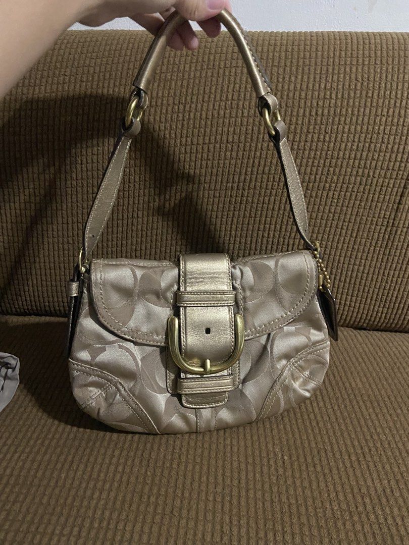 Coach Soho RARE Mini Sateen Gold Hardware (Category: Luxury Bags & Wallets) located in Manila. Submitted by louraine_gab (Listing ID 1466307240, Image 2). Description: - Authentic Coach shoulder bag in gold metallic signature C jacquard fabric - Stylish front flap closure accented with a classic brass buckle detail - Comfortable matching leather strap for easy everyday wear - Complete with the iconic Coach leather hangtag on a ball chain - Compac