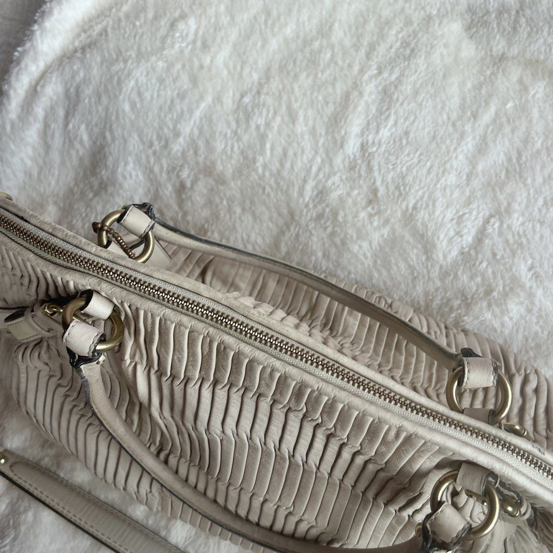 Coach Sophia Shoulder Bag (Category: Luxury Bags & Wallets) located in Lucban. Submitted by mochi__aa (Listing ID 1467071194, Image 3). Description: AUTHENTIC Coach Sophia Shoulder Bag in Bone Color 💫 SELLING SUPERSALE, NEED FUNDS Soooo pretty in person SWEAR! 😍 - Has signs of use, but no major flaws - No crackings/chappings, rubber lining is still intact 💓 - Dirts & stains are removable by wipes All details are posted ✨.