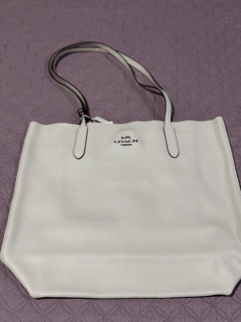 COACH Thea Tote (Category: Tote Bags) located in General Trias. Submitted by meryowls999 (Listing ID 1466990694, Image 3). Description: Brand new with paper bag Bought in the US for personal use. Decluttering as i haven’t used it since then. for size idea please see photos with approx 14” laptop ***laptop not included. only for size comparison .