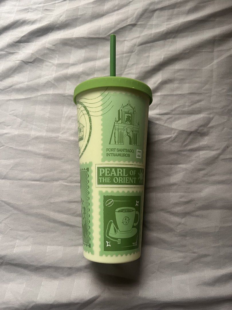 Coffee Bean & Tea Leaf Tumbler (Category: Water Bottles & Tumblers) located in Las Pinas. Submitted by basicapparel_mnl (Listing ID 1467024517, Image 2). Description: - Brand: The Coffee Bean & Tea Leaf - Design: Green and cream with Philippine landmarks stamp (Fort Santiago, Banaue Rice Terraces, Sorbetes) - Includes: Matching lid and straw - Material: Durable plastic - Condition: Brand new / Excellent collectible drinkware.