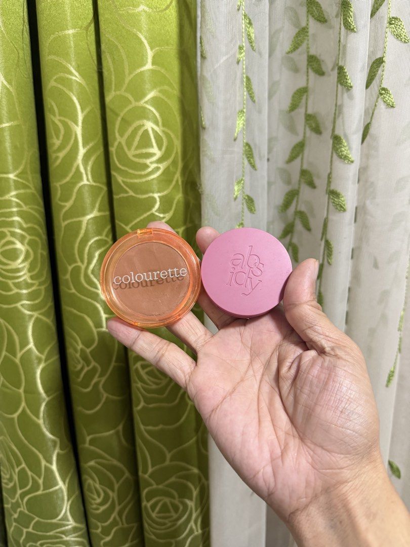 Colourette and Absidy cosmetics makeup (Category: Makeup) located in Manila. Submitted by misstiffany28 (Listing ID 1467139199, Image 1). Description: - Bundle includes: Colourette & Absidy makeup items - Item 1: Orange-toned compact with clear lid and printed branding - Shade: Latte - Item 2: Pink round container with debossed lettering on the lid - Shade: Peony - Condition: Clean packaging and good amount of product left - Perfect for daily use