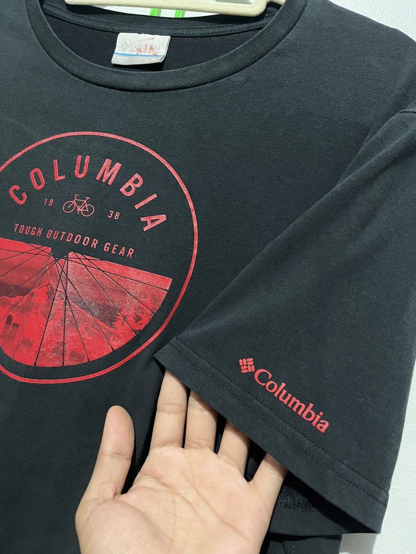 Columbia bike tee (Category: Activewear) located in Cebu City. Submitted by thrift.sht (Listing ID 1467033140, Image 3). Description: Columbia Outdoor Tee 🚲 ✔ Brand: Columbia - Tough Outdoor Gear ✔ Color: Black / Red print ✔ Size: L-XL (oversized) ✔ Condition: 9/10 - black pa kaayo, no crack ✔ Design: Bike wheel graphic - 1938 📍 Cebu City Meet up / J&T / LBC.