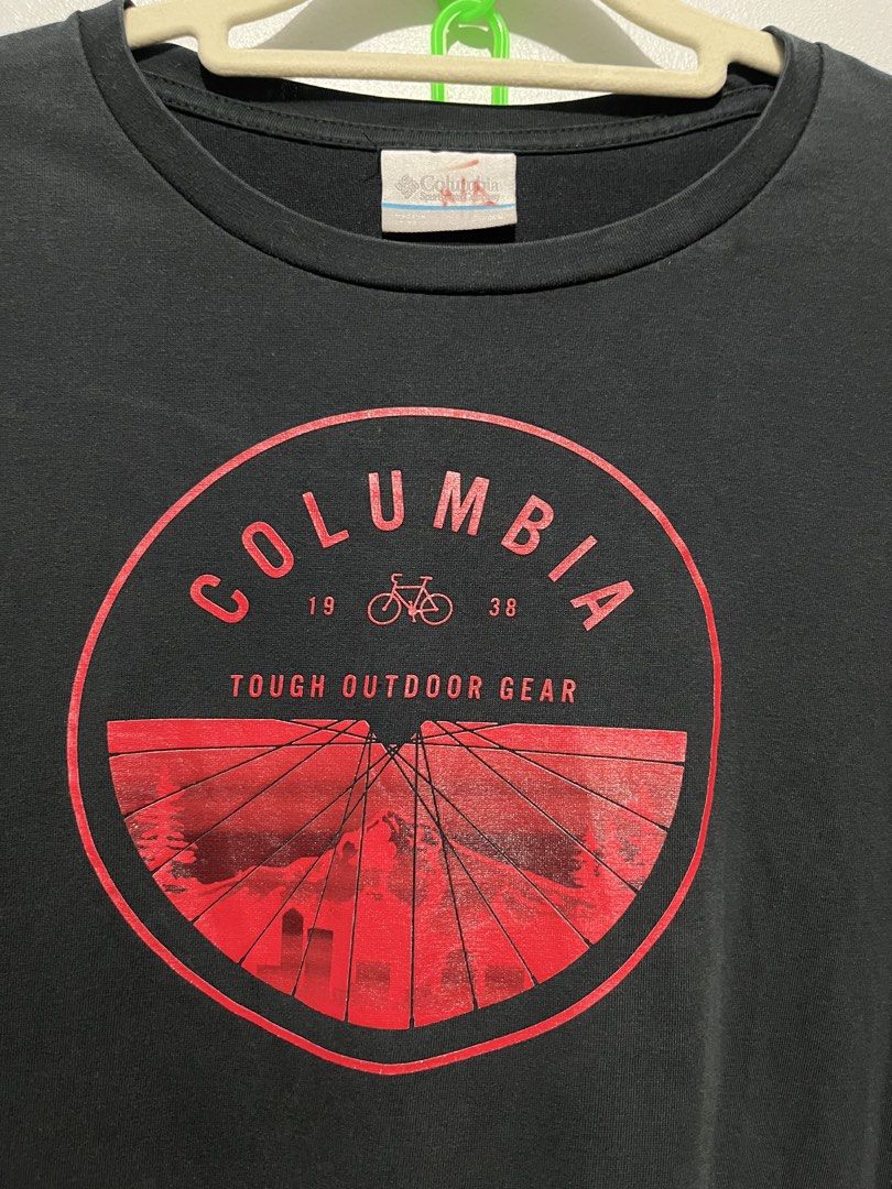Columbia bike tee (Category: Activewear) located in Cebu City. Submitted by thrift.sht (Listing ID 1467033140, Image 2). Description: Columbia Outdoor Tee 🚲 ✔ Brand: Columbia - Tough Outdoor Gear ✔ Color: Black / Red print ✔ Size: L-XL (oversized) ✔ Condition: 9/10 - black pa kaayo, no crack ✔ Design: Bike wheel graphic - 1938 📍 Cebu City Meet up / J&T / LBC.