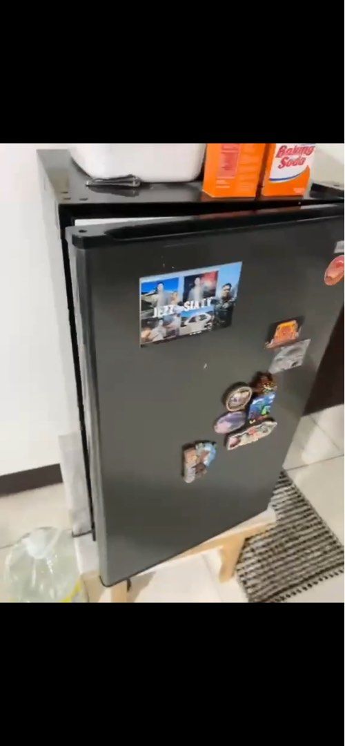 Compact Mini Fridge Single Door Refrigerator (Category: Refrigerators and Freezers) located in Manila. Submitted by curated.clutter12 (Listing ID 1467007006, Image 2). Description: - Compact single door mini fridge in black and white - Ideal size for bedrooms, dorms, or office spaces - Clean interior featuring 3 wire shelves and a bottom crisper drawer - Door includes 2 convenient storage racks - Exterior personalized with decorative magnets and 