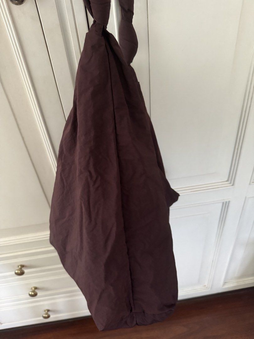 COS Quilted Oversized Hobo Bag (Category: Shoulder Bags) located in Manila. Submitted by filibaby (Listing ID 1467058738, Image 3). Description: - Brand: COS - Style: Oversized quilted shoulder bag / slouchy hobo - Color: burgundy undertones - Material: Soft, padded fabric - Details: Knotted strap detail and secure top zip closure - Storage: Spacious main compartment with an interior zipped pocket for small items Hardly used. No visible flaws.