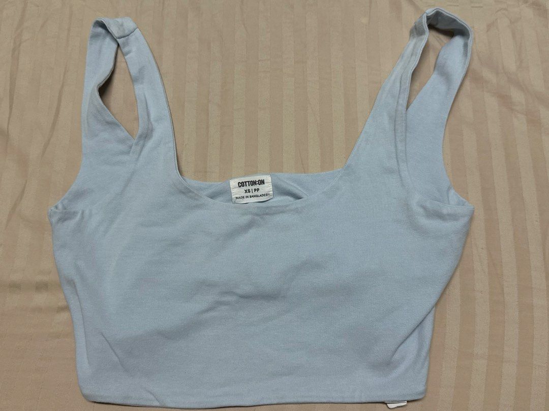 Cotton On Crop Top Bundle Red Light Blue XS (Category: Sleeveless) located in Las Pinas. Submitted by camellaaaaaa (Listing ID 1467074413, Image 2). Description: - Brand: Cotton On - Set of 2: Bright red and light blue - Size: XS - Style: Scoop neck with thick straps - Fabric: Soft, stretchy cotton - Condition: Great everyday basics that pair well with high-waisted bottoms.