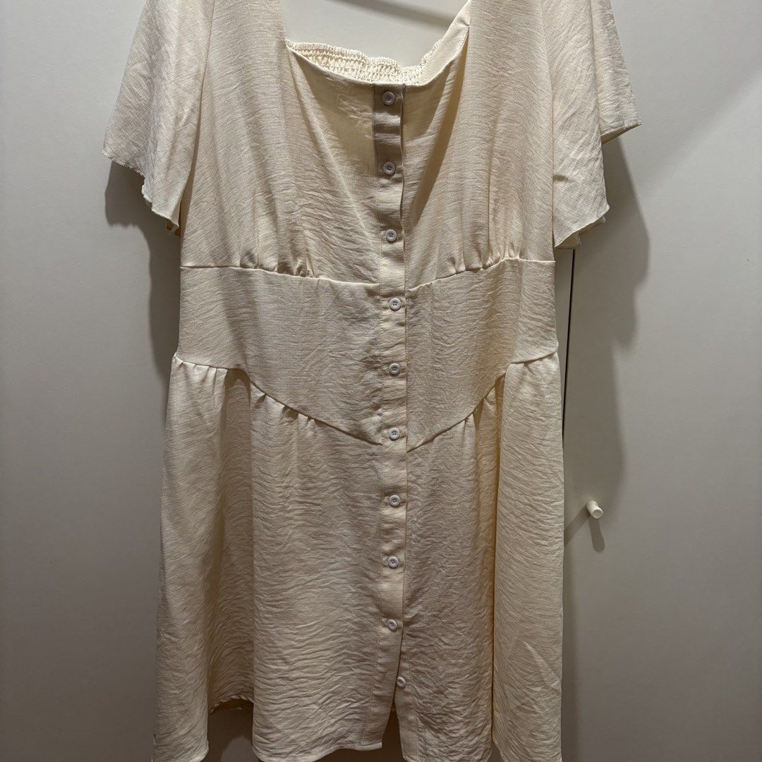 Cream Button-Front Short Sleeve Dress (Category: Dresses) located in Makati City. Submitted by litebnz (Listing ID 1466990965, Image 1). Description: - Color: Cream - Style: Short sleeve dress with square neckline and flared skirt - Details: Front button-down closure and smocked back for a comfortable fit - Fabric: Light textured material - Condition/Use: Brand new / Easy to throw on for casual days out.