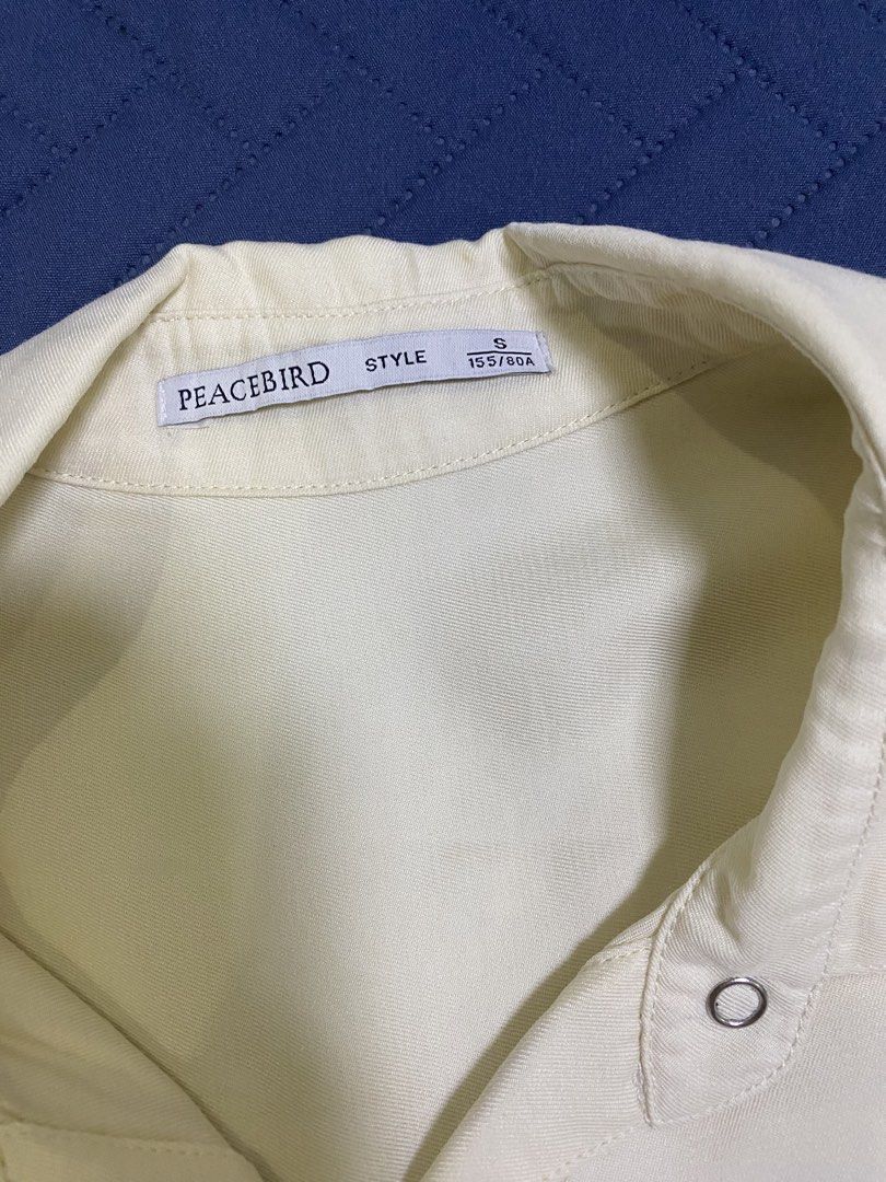 Cream Button-Up Long Sleeve Shirt (Category: Longsleeves) located in Manila. Submitted by escherichiaa (Listing ID 1467137278, Image 2). Description: - Brand: Peacebird - Color: Cream / Neutral - Style: Collar neck, snap button front, puff shoulders with gathered cuffs - Size & Fit: Fits Small to Medium (Best for 34"-36" bust) - Condition: Clean fabric, easy to style with denim shorts or skirts.