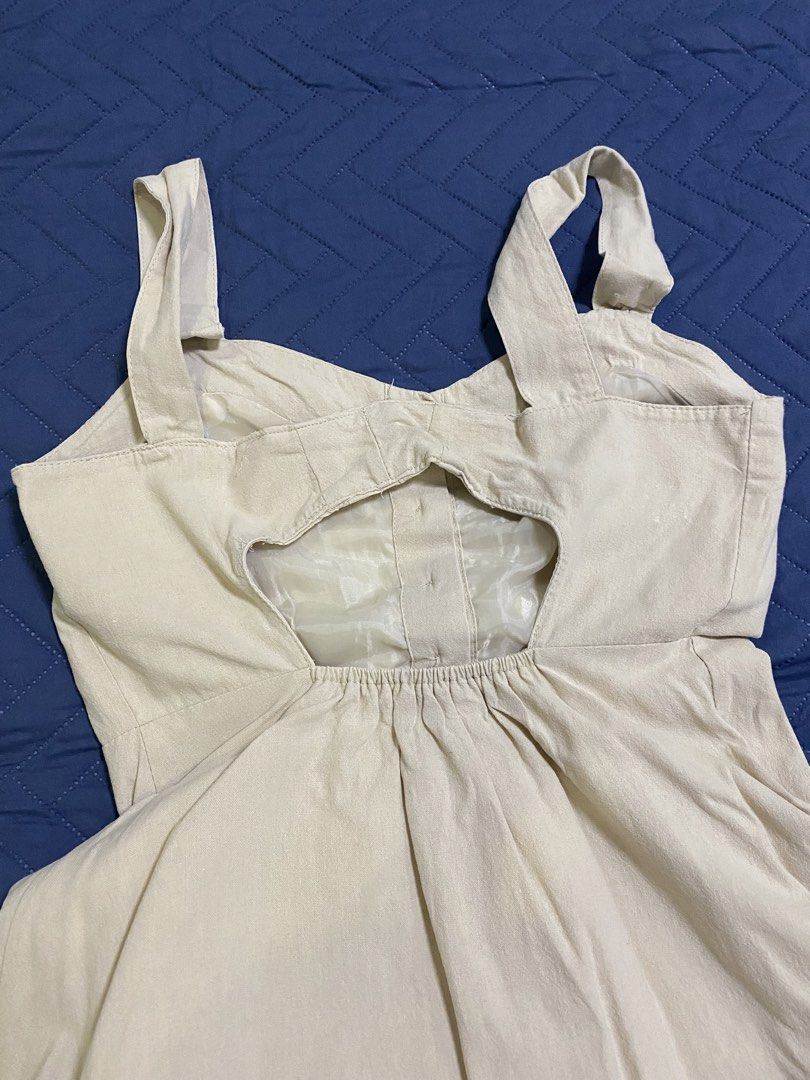 Cream Midi Dress Button Front Cutout Back (Category: Dresses) located in Manila. Submitted by escherichiaa (Listing ID 1467131992, Image 3). Description: - Cream midi dress from Korean brand - Thick straps with button-down front - Stylish cutout detail at the back - Elasticized waist for a comfortable fit - Fully lined interior - Great staple piece for warmer weather, pairs with sandals or sneakers - Clean fabric with no stains or damage.