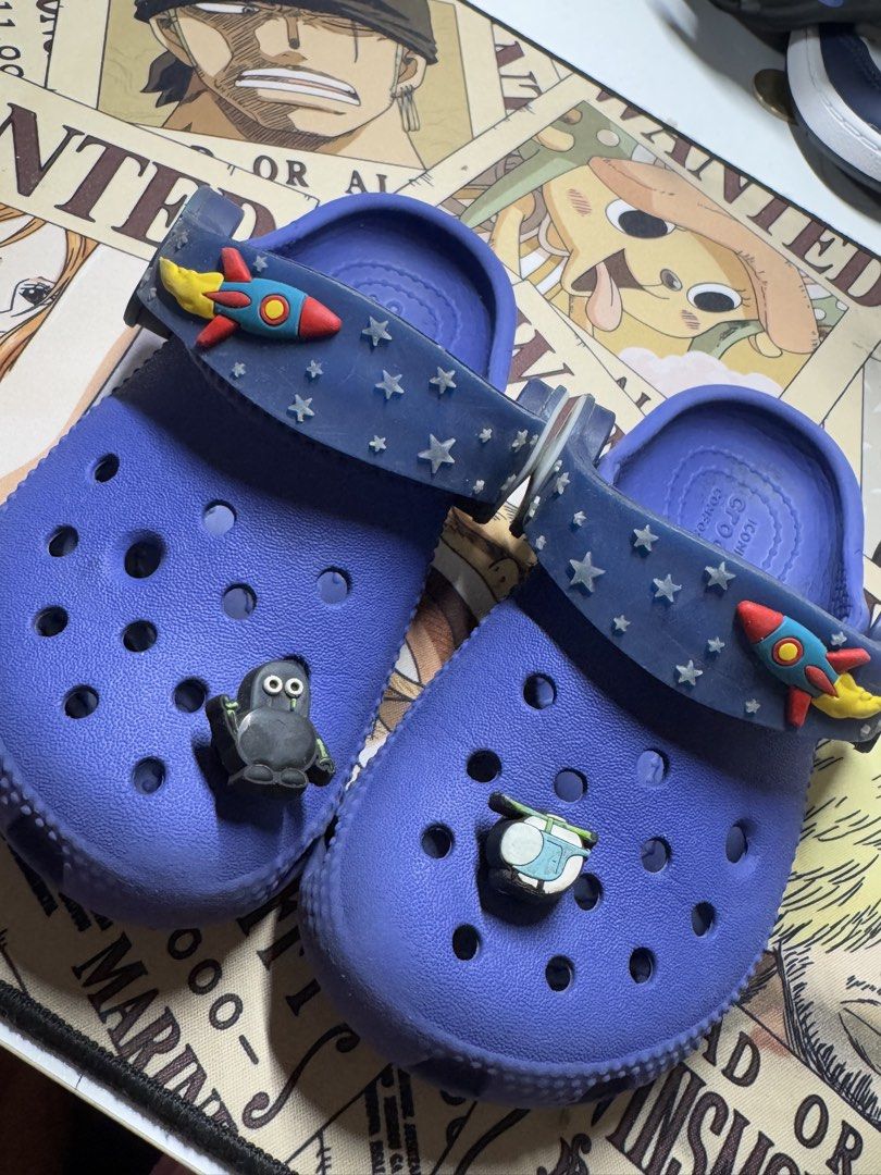 Crocs C Imagination Lights Backstrap (Category: Babies & Kids Fashion) located in Pasig City. Submitted by clarissab._2323 (Listing ID 1467140157, Image 1). Description: - Size: C8 kids - Color: dark Blue - Back Strap Lights still working - includes 2 jibbitz ( robot and helicopter) - Comfort: Iconic Crocs comfort footbeds - Condition: Minor wear on soles from normal use, overall still in great shape - needs cleaning .