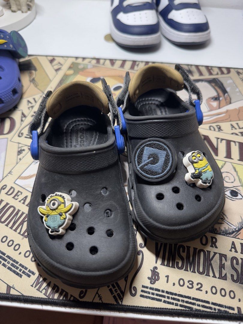 Crocs Toddler Echo Clog Black Size C7 (Category: Babies & Kids Fashion) located in Pasig City. Submitted by clarissab._2323 (Listing ID 1467138557, Image 2). Description: - Item: Toddler Black Crocs Echo Clogs - Size: C7 (molded into the rubber sole) - Color/Details: Khaki adjustable heel strap with blue hardware - Extras: Includes 2 attached Jibbitz charms (Minion character) - Features: Comfortable cushion footbed, slip-on design, and top ventil