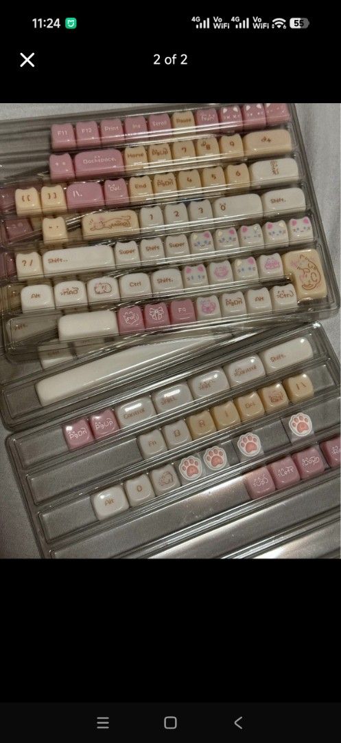Cute Cat Theme Mechanical Keyboard Keycaps Set (Category: Computer Keyboard) located in Imus. Submitted by jamillabrillantes (Listing ID 1466993258, Image 1). Description: - Full set of custom mechanical keyboard keycaps - Aesthetic pastel pink, cream, and beige colorway - Cute cat-themed design with cat faces, paw prints, and graphics - Features unique rounded cat ear corners on the top profile - Includes alphanumeric keys, function rows, arrows