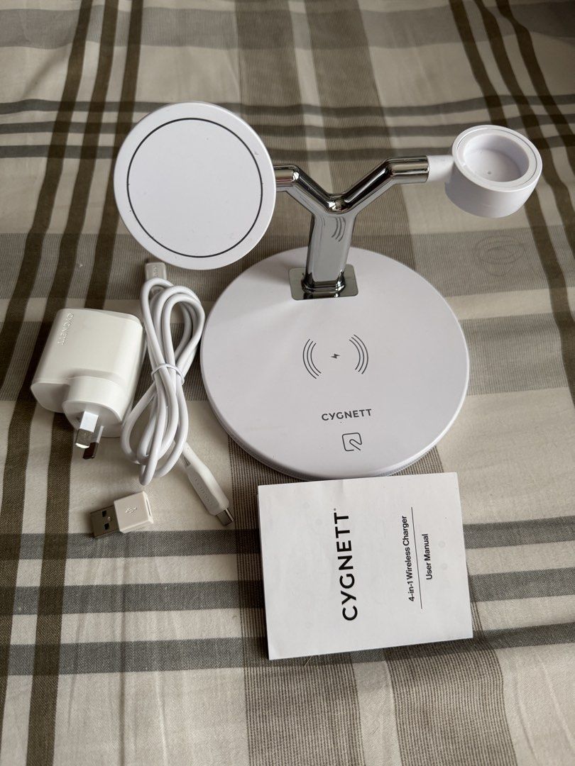 Cygnett 4 in 1 Wireless Charger (Category: Other Gadgets) located in Quezon City. Submitted by kryshnanzyanna (Listing ID 1466989368, Image 3). Description: - Brand: Cygnett - Model: 4-in-1 Wireless Charger - Condition: Open box, never been used (like new) - Features: Simultaneously charge up to 3 devices (phone, smartwatch, earbuds) with dedicated spots - Power: Up to 20W power with integrated night light - Color: White and chrome finish - Inclu