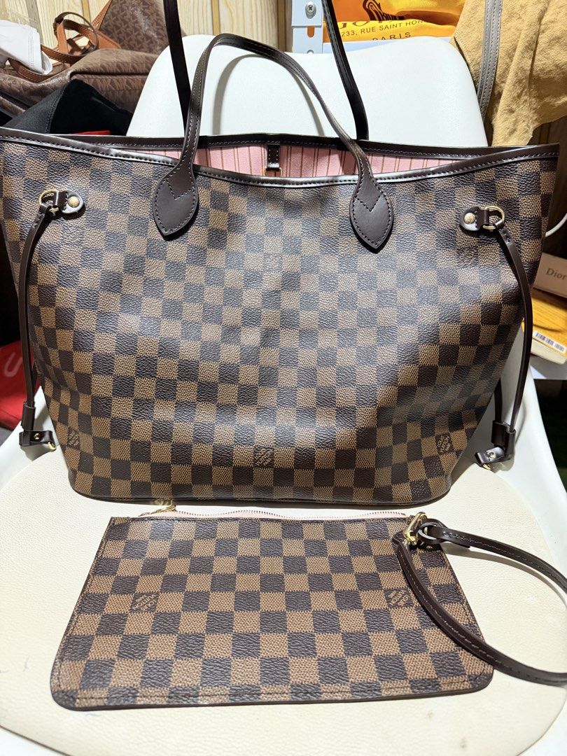 Damier Neverfull MM in Pink (Category: Luxury Bags & Wallets) located in Quezon City. Submitted by musthaveluxe (Listing ID 1467138271, Image 1). Description: In good condition MM size Searchable datecode.