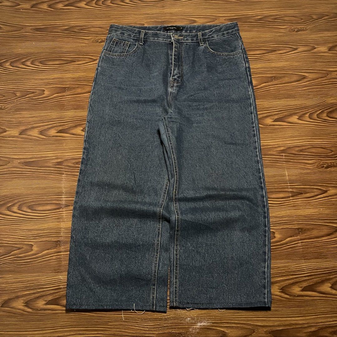 Dark blue hard denim baggy pants (Category: Jeans) located in Iligan City. Submitted by kd_thrift_shop (Listing ID 1466811146, Image 1). Description: Waist:34 Length:37 Thigh:12 Hem:10 No issue Measurements in slide Need wash.