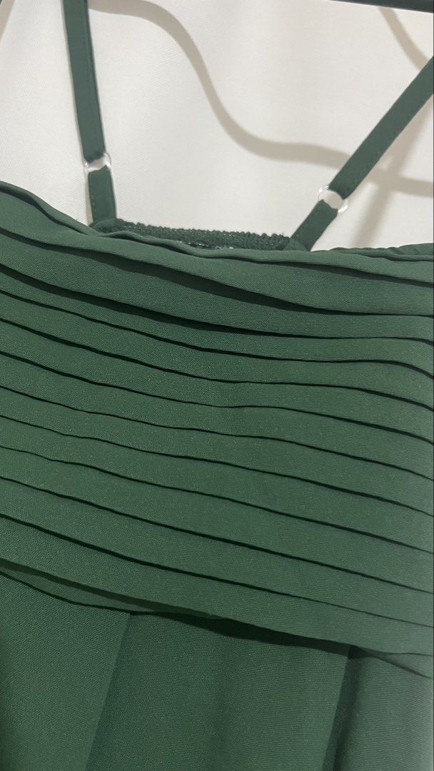 Dark Green Pleated Maxi Dress Cami (Category: Dresses) located in Taguig. Submitted by xkmanzano078817 (Listing ID 1467097975, Image 3). Description: - Color: Dark green - Style: Floor-length maxi dress with pleated bodice and flowy skirt - Fit: Comfortable smocked back panel with adjustable metal-hardware straps - Condition: Worn twice once, freshly washed, and carefully stored Seller’s Profile Height: 5’1” Weight: 53kg Waist:28/28.5in Bust: 33/