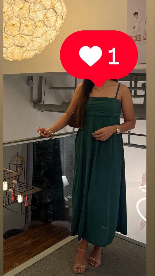 Dark Green Pleated Maxi Dress Cami (Category: Dresses) located in Taguig. Submitted by xkmanzano078817 (Listing ID 1467097975, Image 1). Description: - Color: Dark green - Style: Floor-length maxi dress with pleated bodice and flowy skirt - Fit: Comfortable smocked back panel with adjustable metal-hardware straps - Condition: Worn twice once, freshly washed, and carefully stored Seller’s Profile Height: 5’1” Weight: 53kg Waist:28/28.5in Bust: 33/