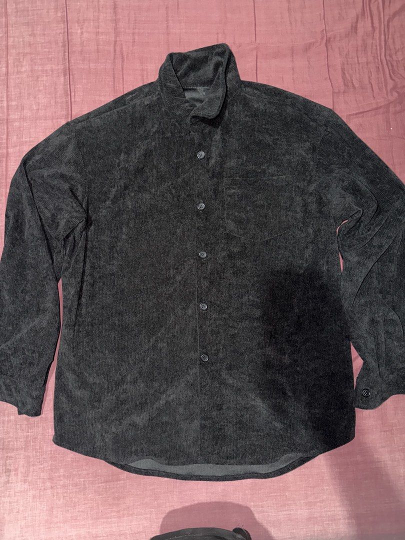 Dark grey corduroy long sleeve button down shirt (Category: Tshirts & Polo Shirts ) located in Manila. Submitted by chccj835237 (Listing ID 1466995172, Image 1). Description: - Color: Dark grey - Material: Textured corduroy fabric - Fit: Relaxed, everyday fit - Design: Long sleeves, classic collar, and dark front buttons - Storage: Single chest pocket on the left side - Styling: Easy to pair with both jeans and trousers.