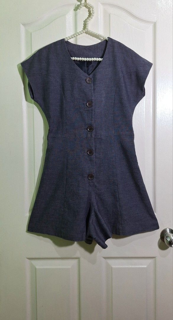 Dark Grey Linen blend Chambray V-Neck Button-Front Romper Shorts small (Category: Rompers) located in San Pablo. Submitted by allyourbrandedneeds (Listing ID 1467083620, Image 2). Description: - Color: Dark grey chambray - Design: Short sleeves, V-neckline, front button-down closure - Fit: Tailored shorts with a flattering fitted waistline - Style: Casual, easy to slip on for everyday wear.