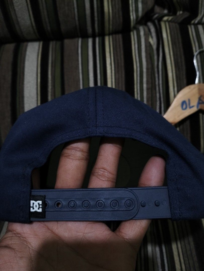 DC Shoes Snapback Cap Blue Red OSFM (Category: Caps & Hats) located in Taguig. Submitted by conniemdcruz (Listing ID 1467094398, Image 2). Description: - Brand: DC Shoes - Color: Dark blue with a red and white embroidered front patch logo - Brim: Flat red brim - Closure: Adjustable plastic snapback at the back - Size: One Size Fits Most (OSFM) - Origin: Made in Bangladesh - Condition: Excellent, includes interior branded tags.