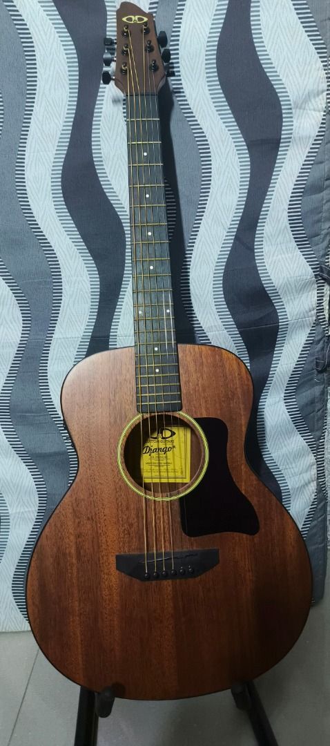 DD Custom Guitars Django Jr Acoustic Electric Guitar Bundle (Category: Musical Instruments) located in Caloocan City. Submitted by natinez (Listing ID 1467131386, Image 3). Description: - Brand: DD Custom Guitars Django Jr acoustic-electric guitar - Finish: Matte brown wood finish with steel strings - Electronics: Built-in G-Tone preamp with tuner and acoustic pickup jack - Included Accessories: Padded green gig bag, folding guitar stand, strap, 