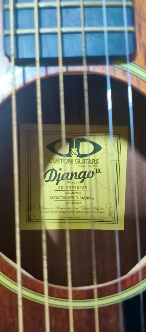 DD Custom Guitars Django Jr Acoustic Electric Guitar Bundle (Category: Musical Instruments) located in Caloocan City. Submitted by natinez (Listing ID 1467131386, Image 1). Description: - Brand: DD Custom Guitars Django Jr acoustic-electric guitar - Finish: Matte brown wood finish with steel strings - Electronics: Built-in G-Tone preamp with tuner and acoustic pickup jack - Included Accessories: Padded green gig bag, folding guitar stand, strap, 