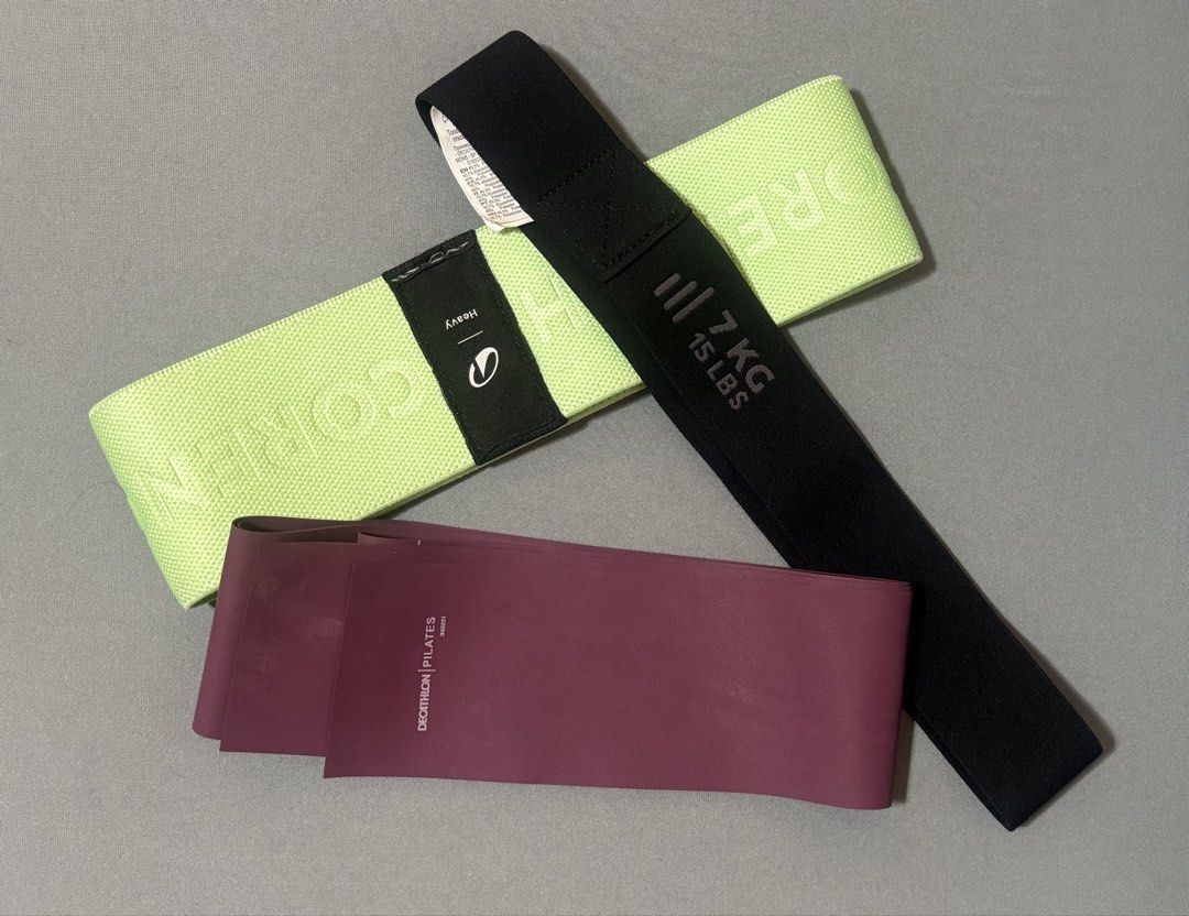 Decathlon Pilates & Core Resistance Bands Set (Category: Toning & Stretching Accessories) located in Quezon City. Submitted by declutternstuff (Listing ID 1466980430, Image 1). Description: - Set of 3 versatile fitness bands for home workouts, stretching, and strength training - Lime green core band (labeled 'heavy') for maximum resistance - Black core band marked 7kg / 15 lbs for intermediate workouts - Burgundy Decathlon Pilates flat band for t