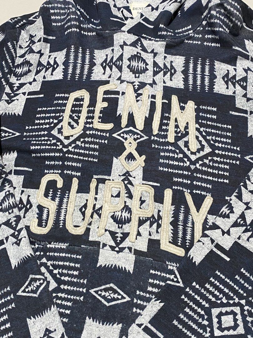 Denim & Supply Ralph Lauren Native Pattern Hoodie Size L (Category: Coats, Jackets and Outerwear) located in Baguio. Submitted by yunothewizardking (Listing ID 1467096028, Image 2). Description: - Brand: Denim & Supply Ralph Lauren - Style: Pullover hoodie with drawstring - Color/Pattern: Navy blue and grey aztec geometric pattern - Details: Large chenille appliqué logo across chest, front kangaroo pocket - Size: Large - Material: 100% Cotton - O