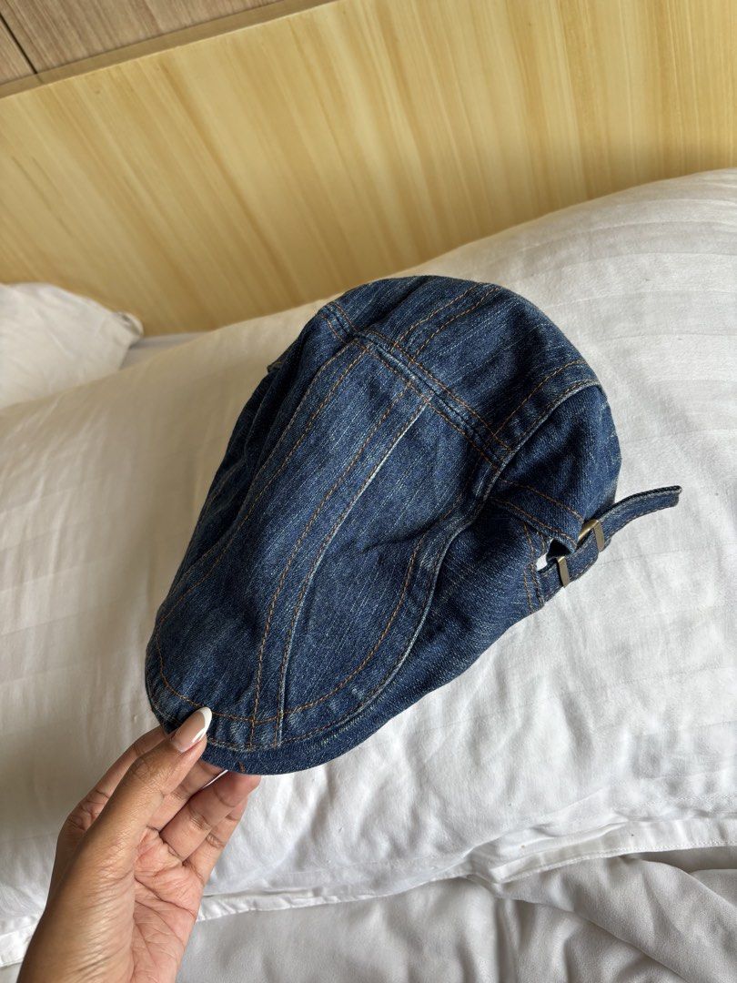 Denim flat cap newsboy hat adjustable buckle (Category: Caps & Hats) located in Manila. Submitted by michaela17_ (Listing ID 1466978899, Image 1). Description: - Dark blue denim flat cap with classic paneled construction - Stylish contrast orange stitching details - Adjustable strap with a secure metal buckle at the back - Comfortable interior with black fabric band and taped seams - Durable material and casual everyday style - Clean inside and o