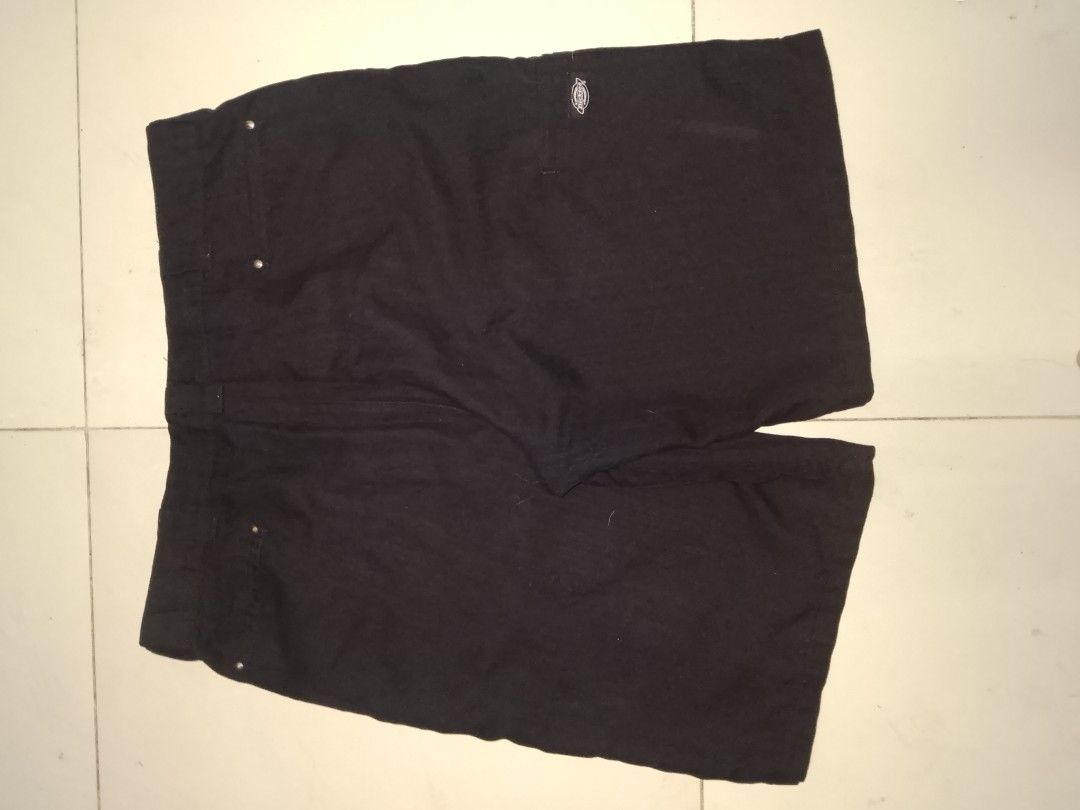 Dickies Black Regular Fit Shorts (Category: Shorts) located in Manila. Submitted by afreemf (Listing ID 1467088807, Image 2). Description: - Brand: Dickies - Fit: Regular fit - Color: Classic Black - Closure: Button-up with belt loops - Storage: Multiple front and back pockets - Details: Signature Dickies logo patch near the hem and back pocket - Material: Sturdy, durable fabric built for daily casual wear.