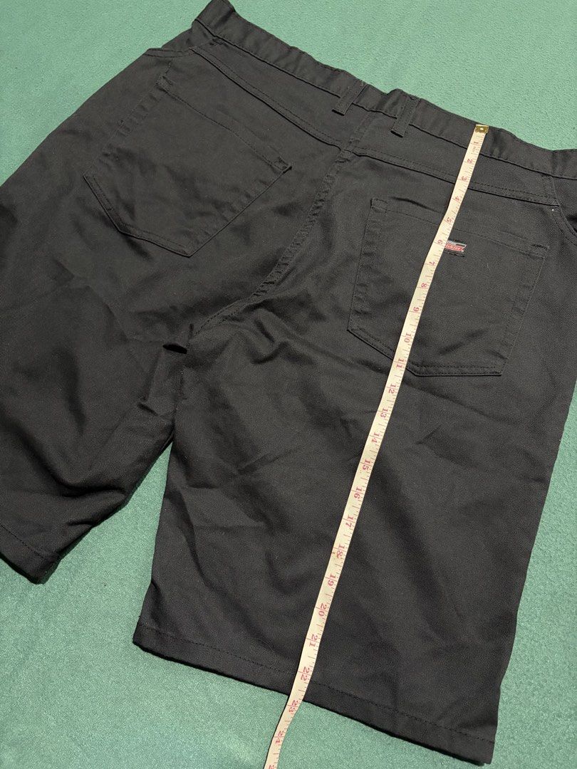 Dickies Black Work Shorts (Category: Shorts) located in Guihulngan. Submitted by fbthriftgoodsniace (Listing ID 1467091922, Image 2). Description: - Brand: Dickies - Color: Black - Style: Classic workwear shorts - Material: Durable cotton blend - Features: Back pockets, logo patch on right pocket, standard belt loops - Condition/Quality: Clean stitching throughout - Length: Approx. 24 inches - Ideal for: Everyday casual wear.