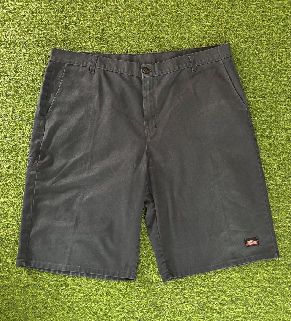 Dickies Black Work Shorts Size 42 (Category: Shorts) located in Makati City. Submitted by rare_thrift_stuff (Listing ID 1467000187, Image 2). Description: - Brand: Dickies - Color: Classic Black - Size: Waist 42 - Material: Durable 65% polyester, 35% cotton fabric blend - Design: Classic multi-pocket utility style with signature logo patch near the hem - Condition: Clean and ready to wear - Ideal for: Everyday wear, skating, or working outdoors.