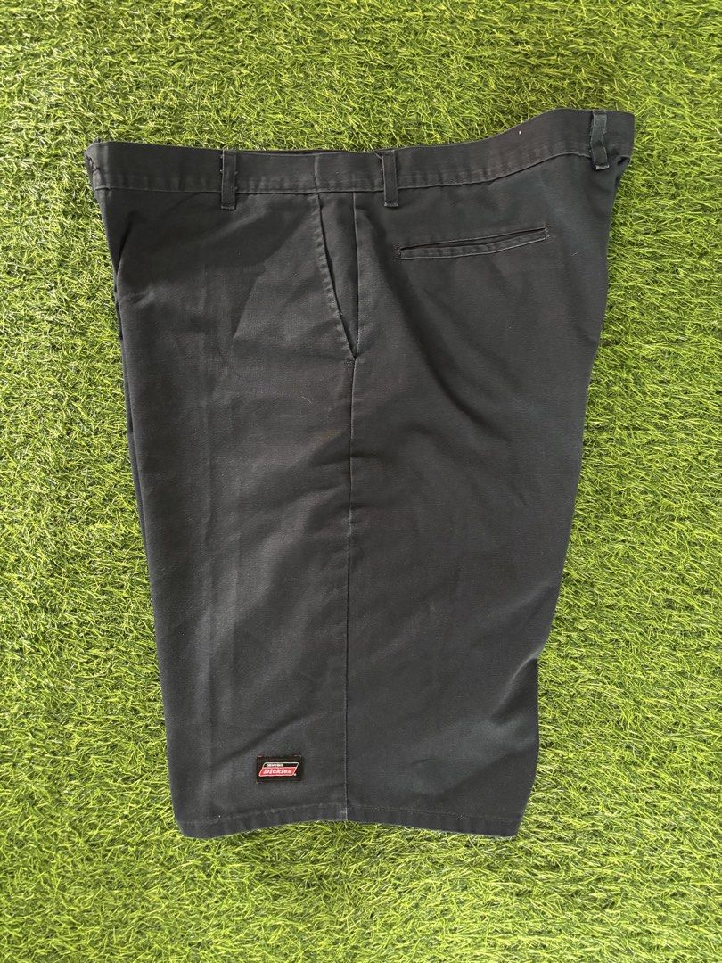 Dickies Black Work Shorts Size 42 (Category: Shorts) located in Makati City. Submitted by rare_thrift_stuff (Listing ID 1467000187, Image 1). Description: - Brand: Dickies - Color: Classic Black - Size: Waist 42 - Material: Durable 65% polyester, 35% cotton fabric blend - Design: Classic multi-pocket utility style with signature logo patch near the hem - Condition: Clean and ready to wear - Ideal for: Everyday wear, skating, or working outdoors.