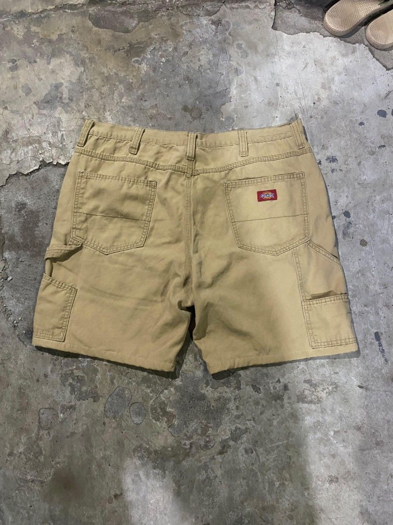 Dickies Cargo Utility Shorts Khaki Tan (Category: Shorts) located in Bacolod City. Submitted by carlo1019 (Listing ID 1467119560, Image 1). Description: - Brand: Dickies - Color: Khaki (Earth tone) - Material: Sturdy, heavy-duty cotton - Features: Multiple side and back pockets, heavy-duty belt loops - Detail: Iconic red Dickies logo patch on back right pocket - Style: Casual, workwear, daily wear.