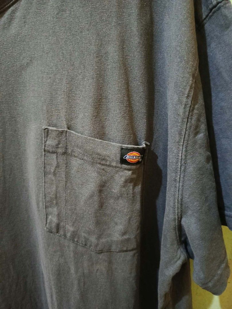 Dickies Pocket T-Shirt Dark Grey (Category: Tshirts & Polo Shirts ) located in Manila. Submitted by collinvien123 (Listing ID 1467099913, Image 2). Description: - Brand: Dickies - Item: Heavy cotton crewneck tee - Color: Dark grey with a cool faded wash look - Size: 2X / 2TG - Features: Single chest pocket with woven logo label - Condition: Pre-loved with normal wear, fabric tag inside side seam is partially torn.