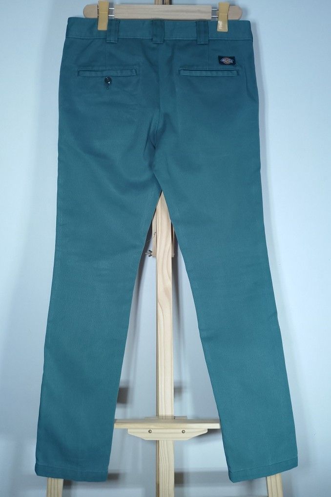 Dickies Teal Chino Pants (Category: Chinos) located in Manila. Submitted by patrickjos06722 (Listing ID 1467145124, Image 3). Description: - Brand: Dickies - Style: Classic workwear chino pants - Color: Teal / Turquoise - Skinny fit - Waist: 32 up - Length: Approx. 40 inches - Details: Crisp pleats, sturdy construction, back welt pockets, and iconic woven logo tag - Condition: Clean fabric, great for everyday casual wear - Shipping via J&T, cost 