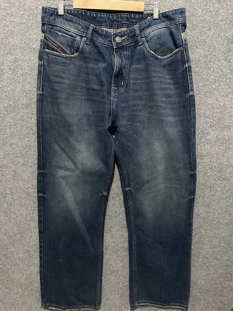 Diesel Blue Denim Jeans (Category: Jeans) located in Villasis. Submitted by justinramosonfb (Listing ID 1467121283, Image 3). Description: - Brand: Diesel - Color/Wash: Blue denim with faded wash - Fit: Straight leg with slight distressing at hem edges - Closure: Classic button fly - Details: Contrast stitching, front pockets, classic back pockets, and rear leather brand patch - Condition: Sturdy denim fabric with interior brand tags.